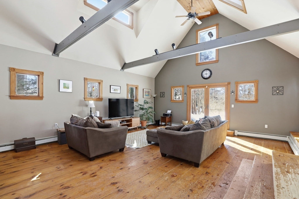 327 Country Way Scituate, MA 02066 - Photo 3 of 39 a living room with furniture and a flat screen tv