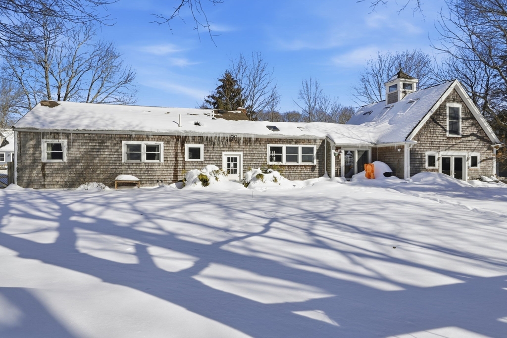 327 Country Way Scituate, MA 02066 - Photo 33 of 39 a view of a white house with a chairs in front of it