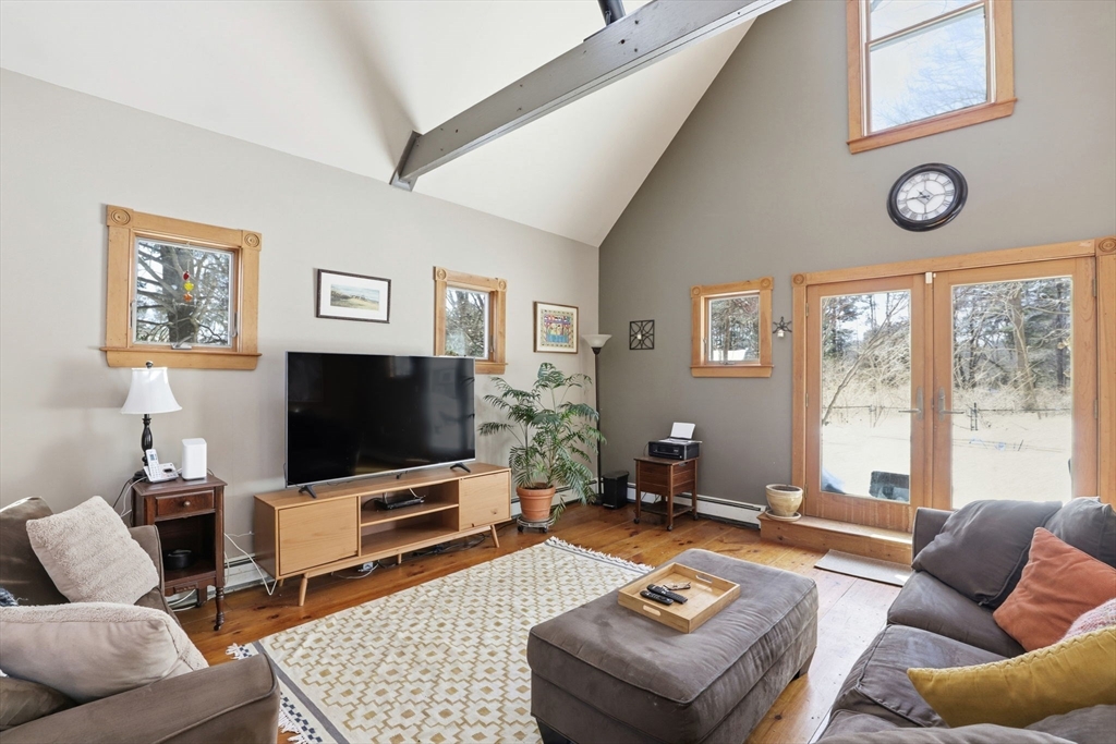327 Country Way Scituate, MA 02066 - Photo 4 of 39 a living room with furniture and a flat screen tv