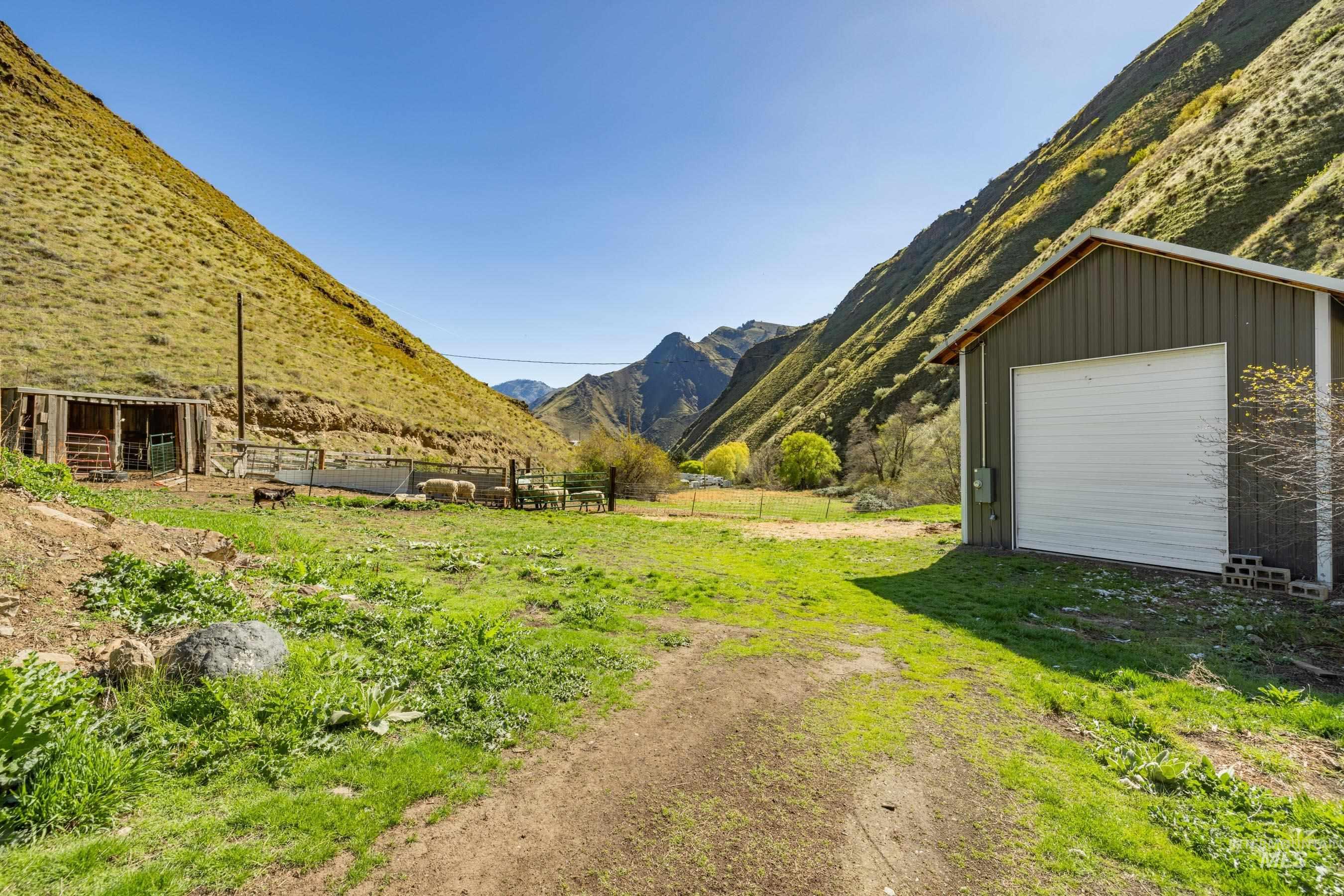 221 Seven Devils Road Riggins, ID 83549 - Photo 27 of 46 View of yard featuring an outbuilding and a mountain view
