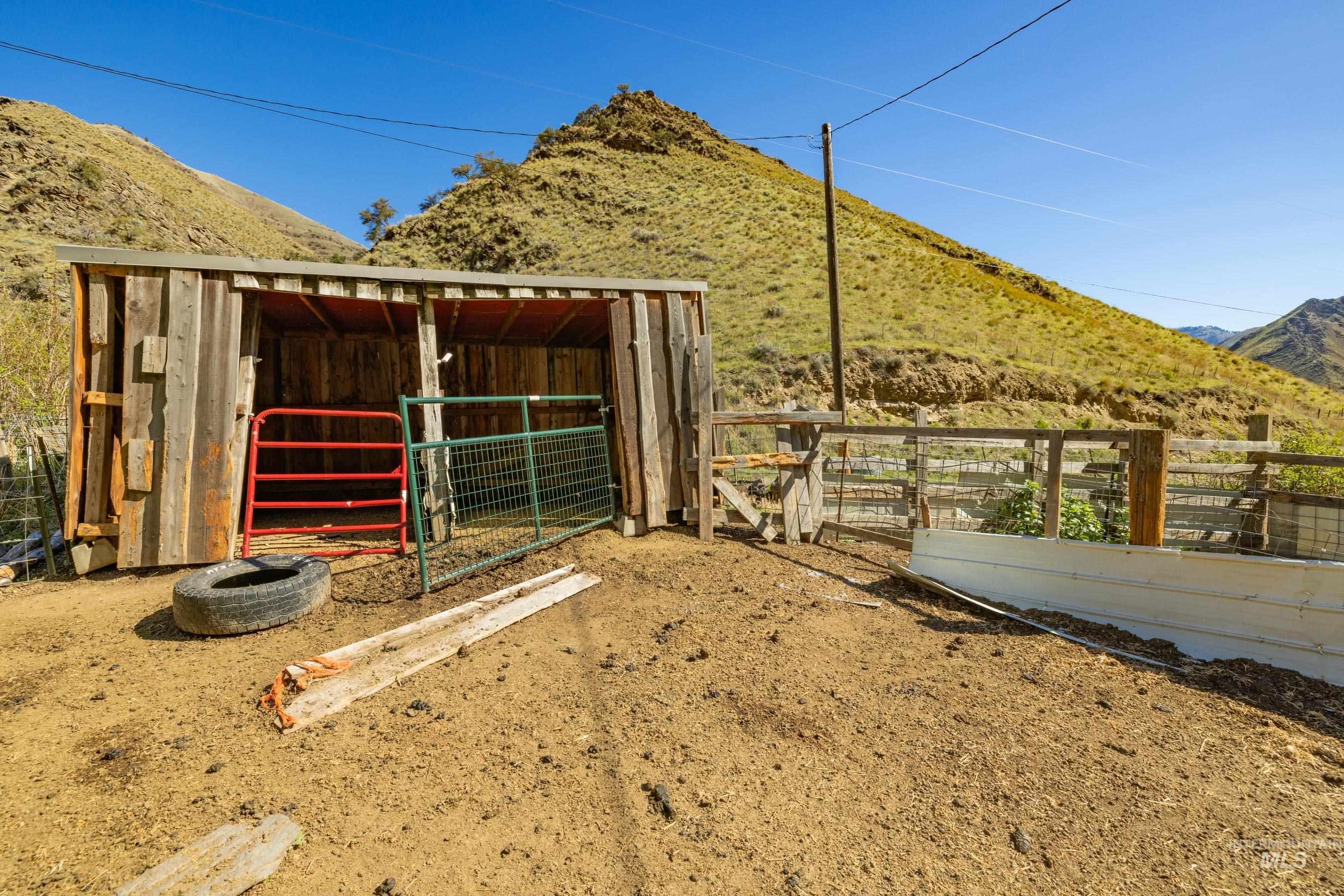 221 Seven Devils Road Riggins, ID 83549 - Photo 29 of 46 View of outbuilding with a mountain view and an exterior structure