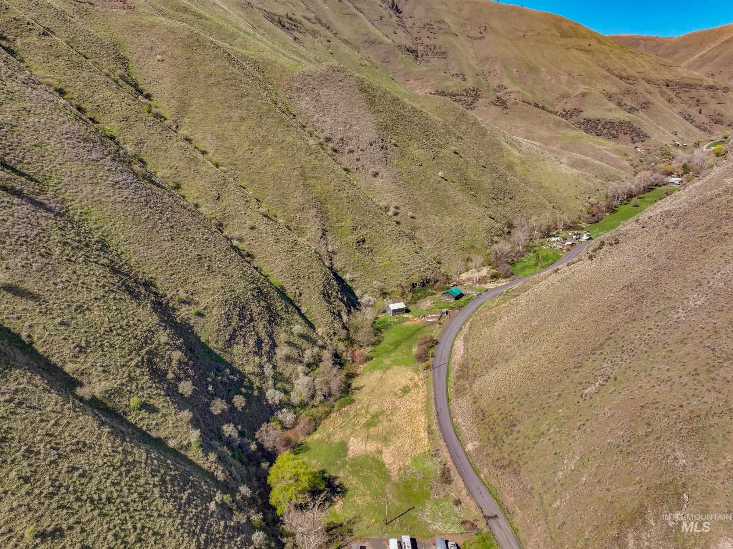 221 Seven Devils Road Riggins, ID 83549 - Photo 44 of 46 Drone / aerial view of a mountainous background
