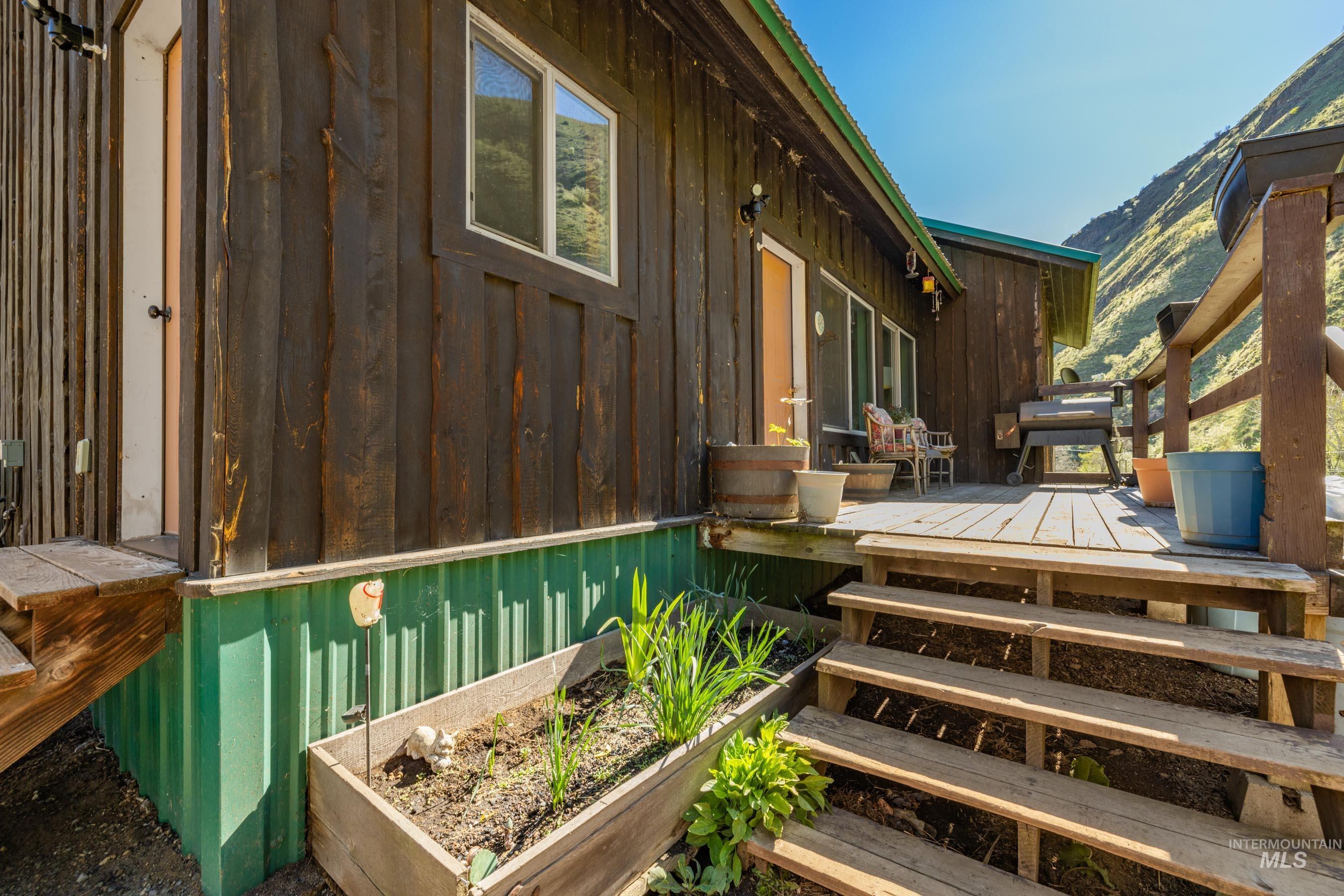 221 Seven Devils Road Riggins, ID 83549 - Photo 5 of 46 Wooden terrace featuring a grill