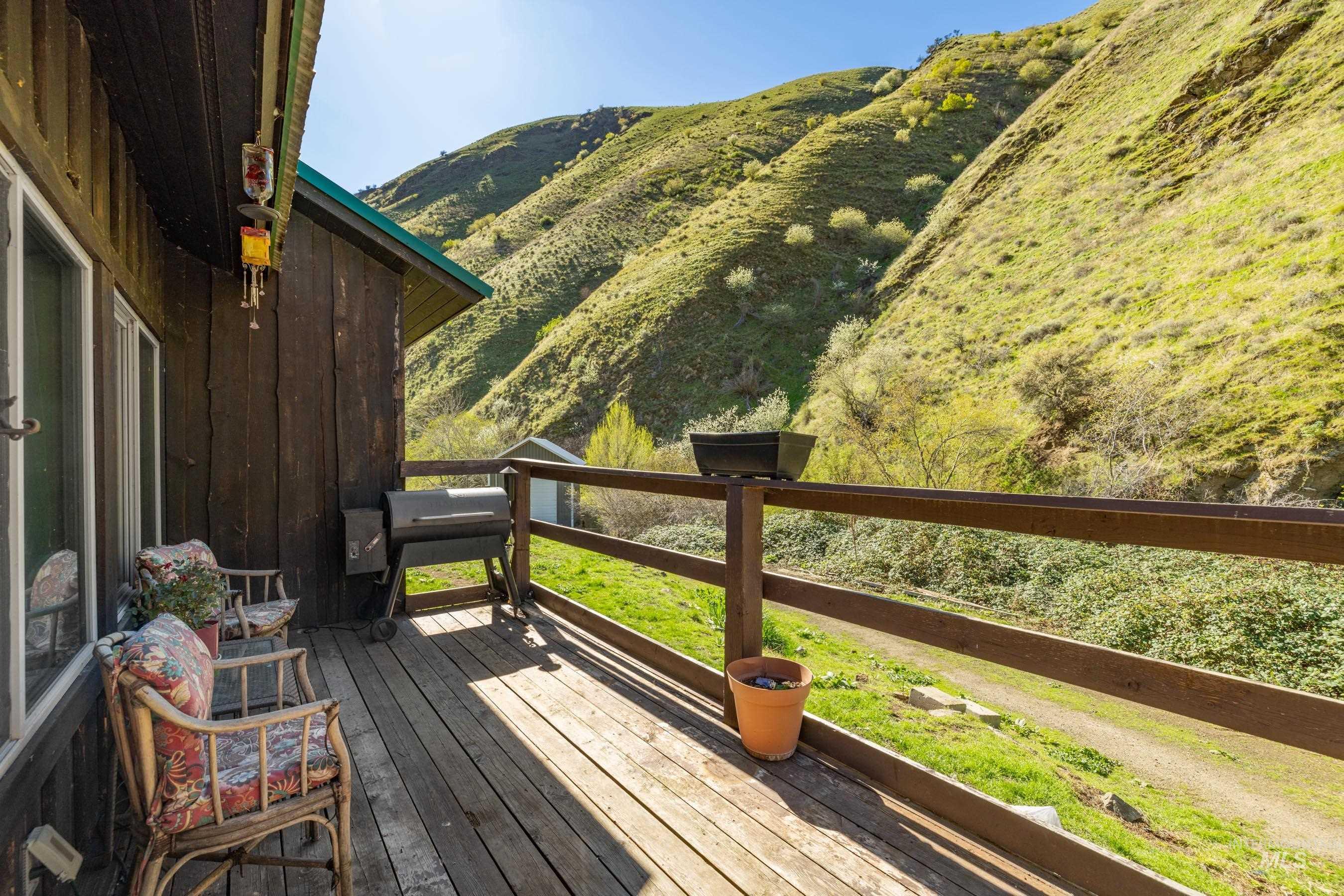221 Seven Devils Road Riggins, ID 83549 - Photo 6 of 46 Deck featuring area for grilling and a mountain view