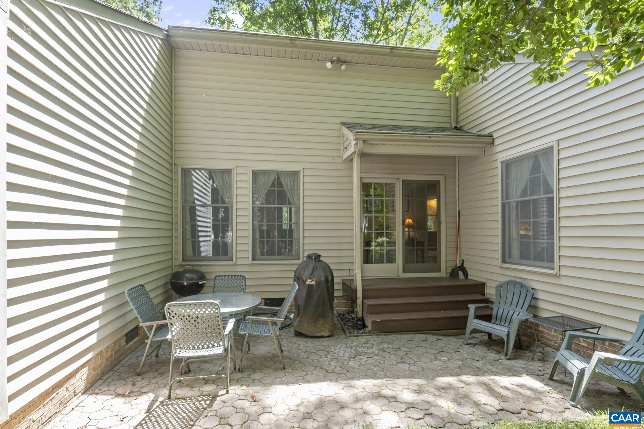 2 Whippoorwill Lane Palmyra, VA 22963 - Photo 28 of 36 a view of a patio with a table and chairs and a barbeque