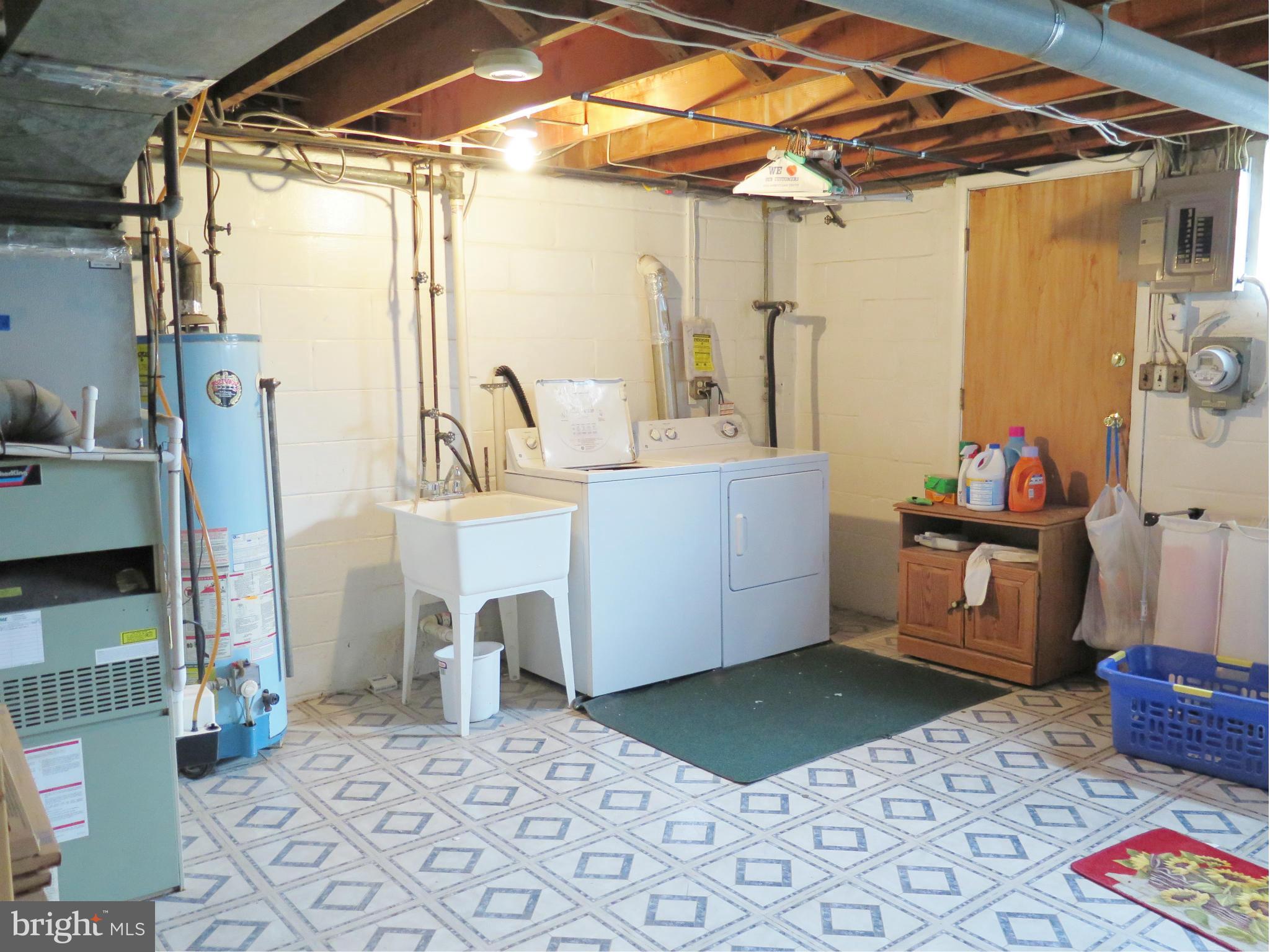 7867 Kavanagh Road Baltimore, MD 21222 - Photo 29 of 29 a utility room with a washer and dryer