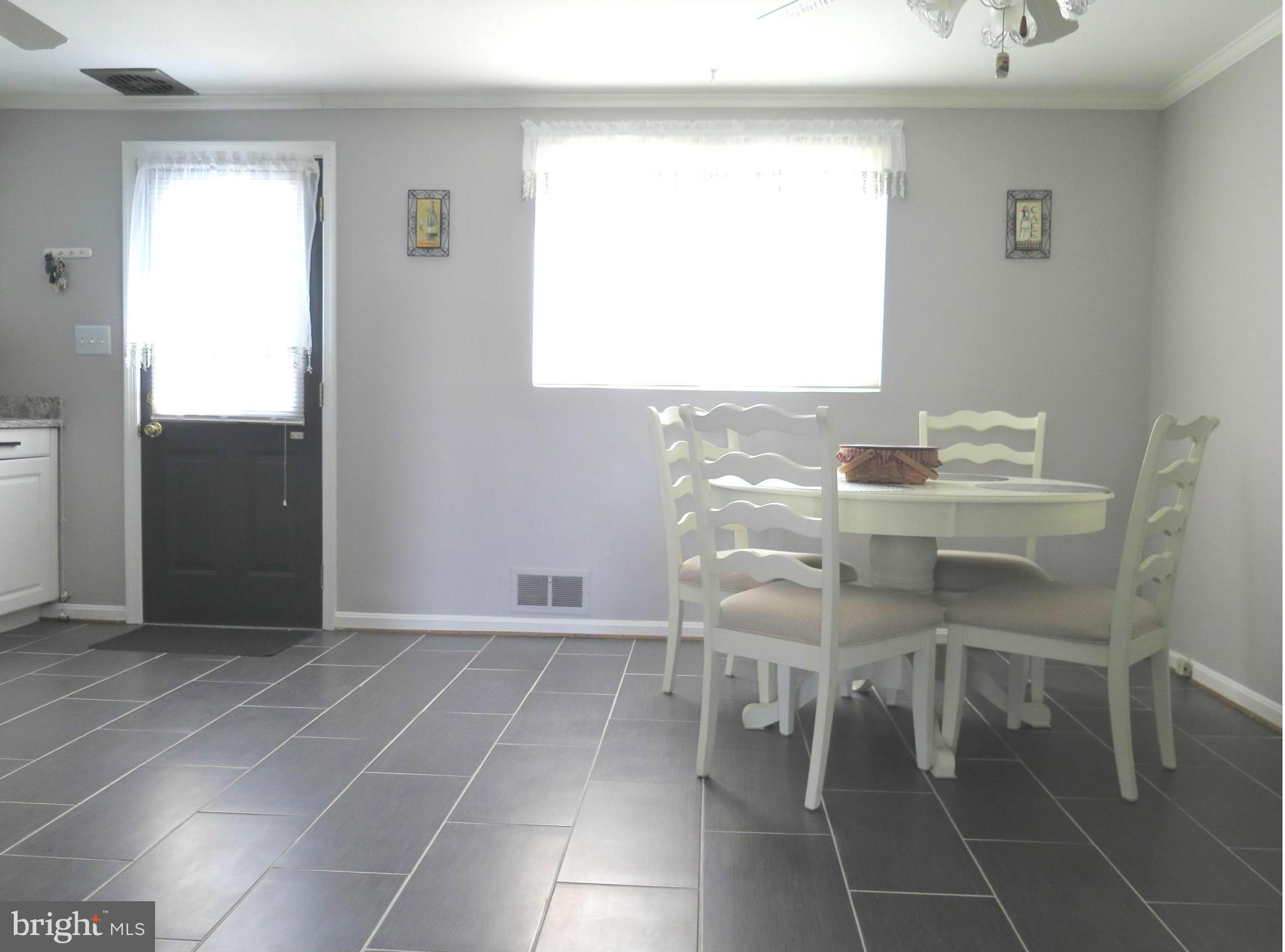 7867 Kavanagh Road Baltimore, MD 21222 - Photo 9 of 29 a room with a table and a window