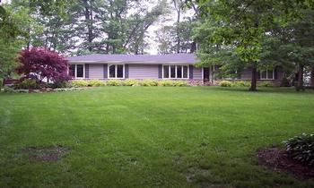 9886 East Fowler Road Rochelle, IL 61068 - Photo 1 of 1 a front view of a house with garden