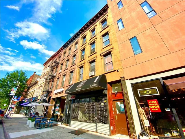 a street sign on a pole on a street