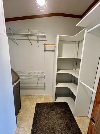 a view of an empty walk in closet