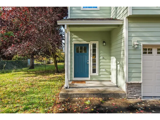 a view of a brick house with a large windows
