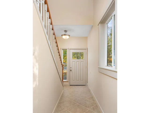 a view of a hallway with stairs