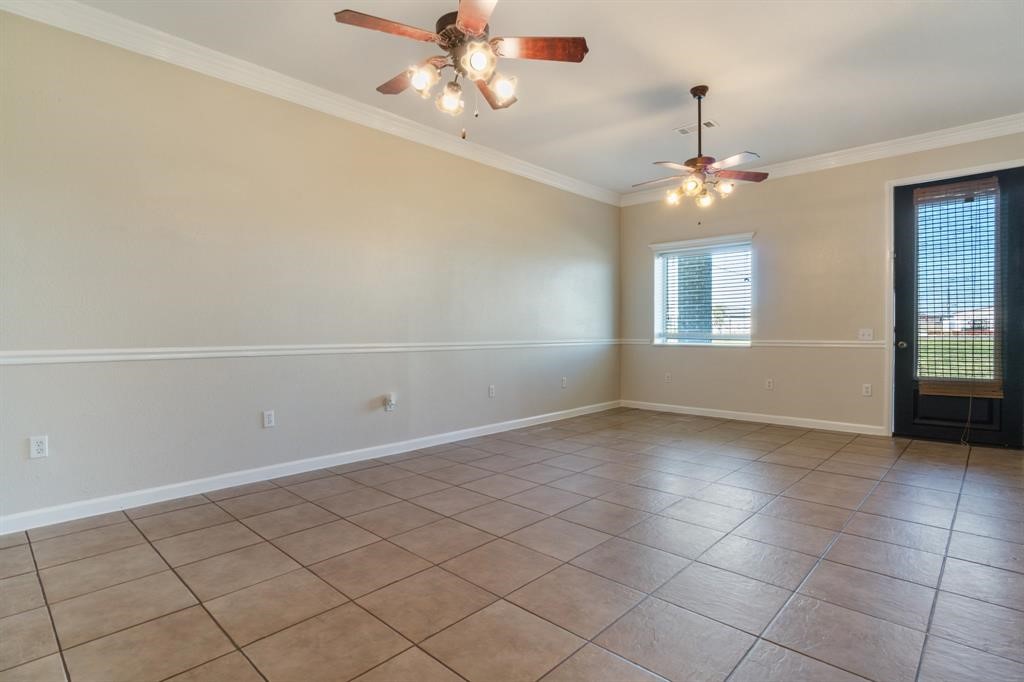 6500 South Fm 565 Rd Cove Cove, TX 77523 - Photo 4 of 8 a view of an empty room with a window