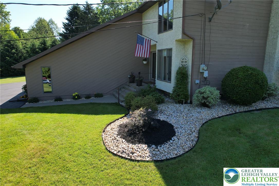 3470 Brodhead Road Bethlehem, PA 18020 - Photo 10 of 84 A neatly manicured lawn complements the modern facade, featuring an inviting entrance and well-tended landscaping.