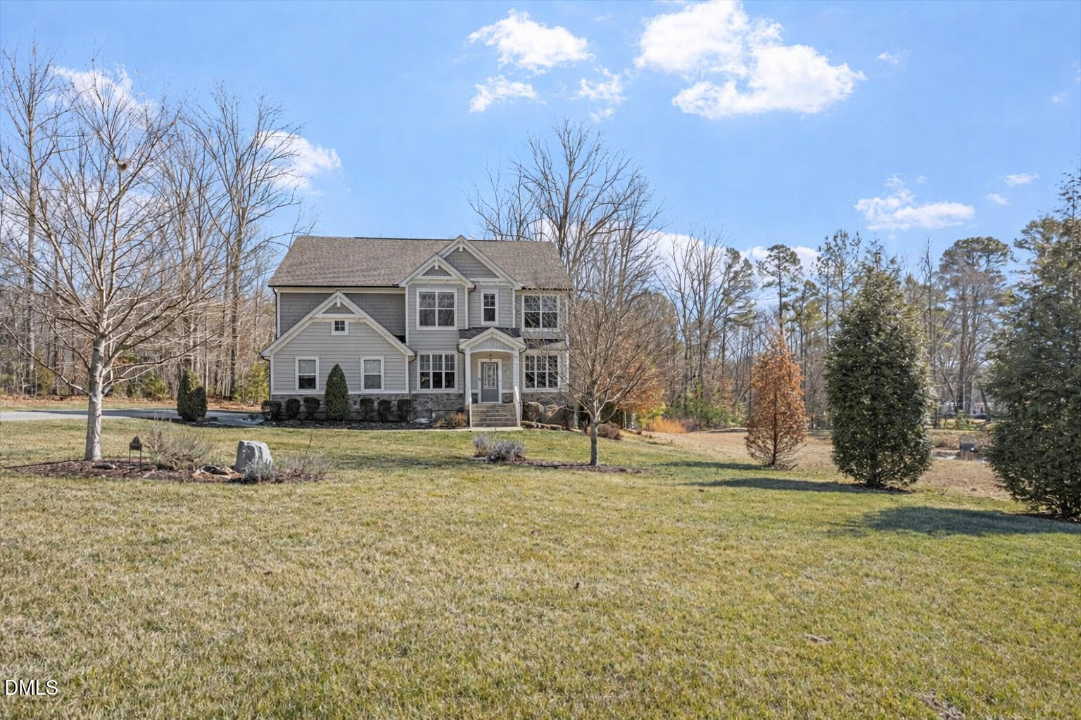 2301 Greenbrook Lane Durham, NC 27705 - Photo 4 of 42 a house with trees in the background