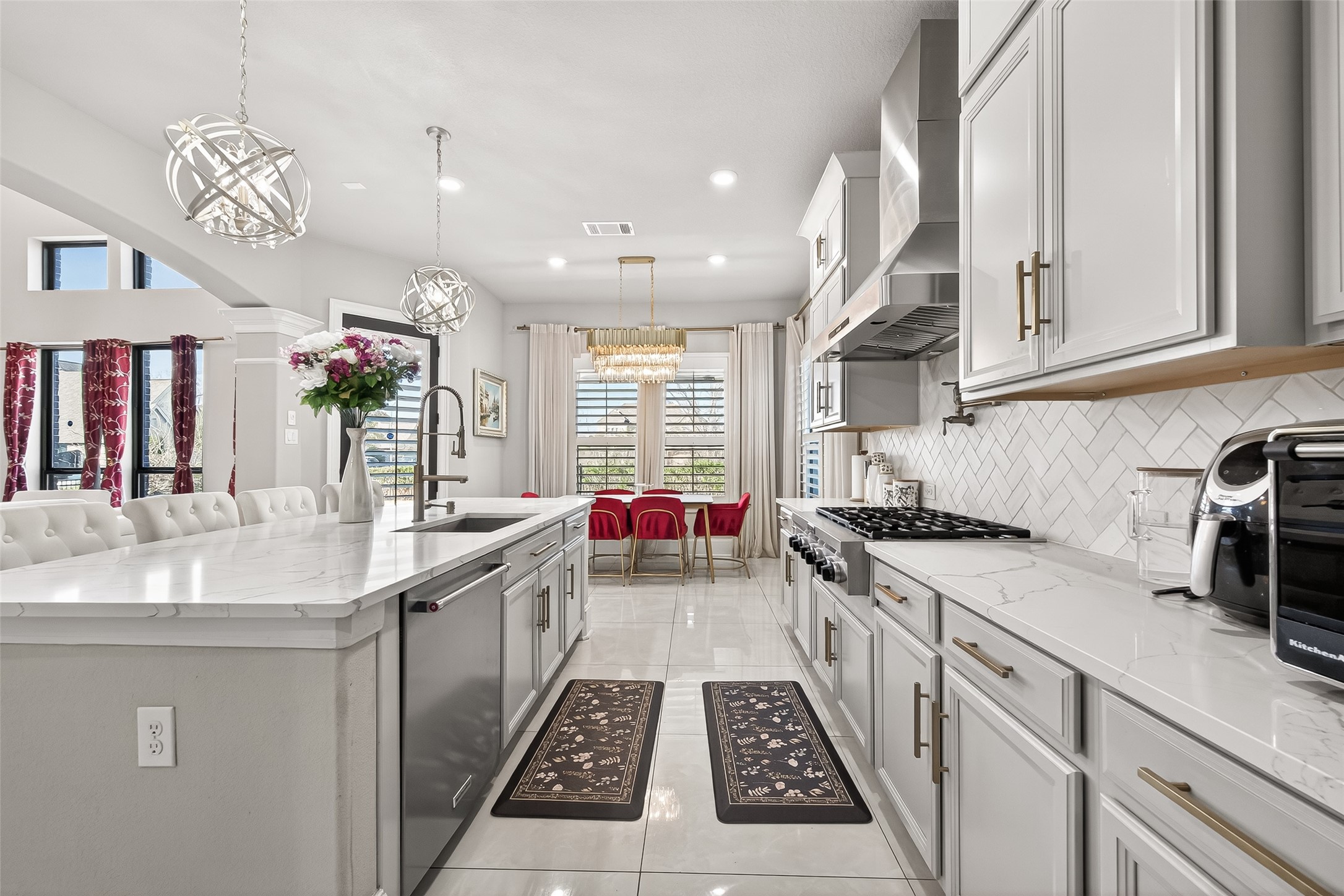 1122 Thyme Rise Lane Richmond, TX 77406 - Photo 20 of 50 a kitchen with a sink stove and cabinets