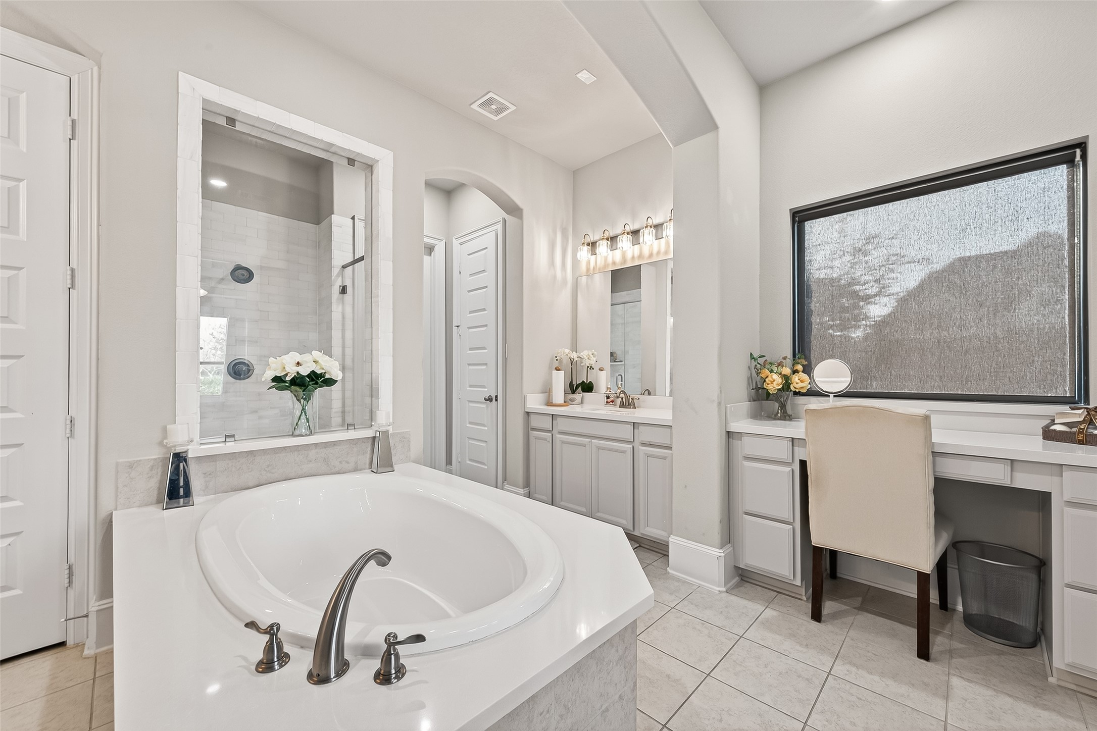 1122 Thyme Rise Lane Richmond, TX 77406 - Photo 30 of 50 a spacious bathroom with a double vanity sink a mirror a bathtub and shower