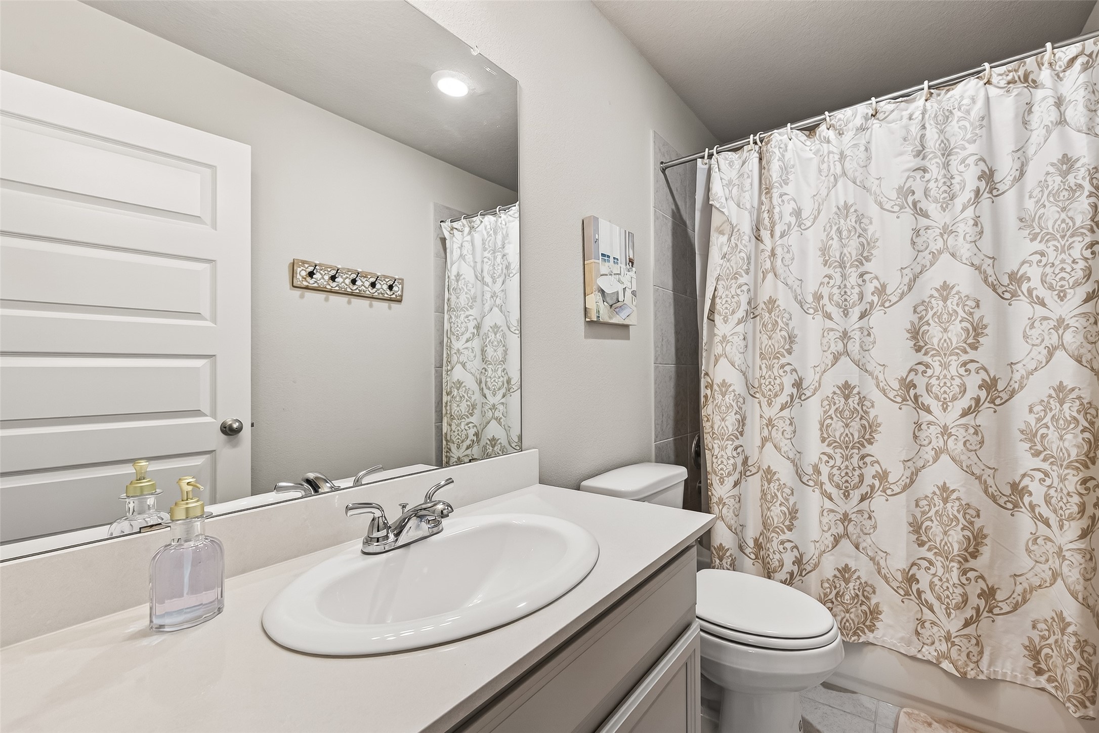 1122 Thyme Rise Lane Richmond, TX 77406 - Photo 38 of 50 a bathroom with a sink and a mirror