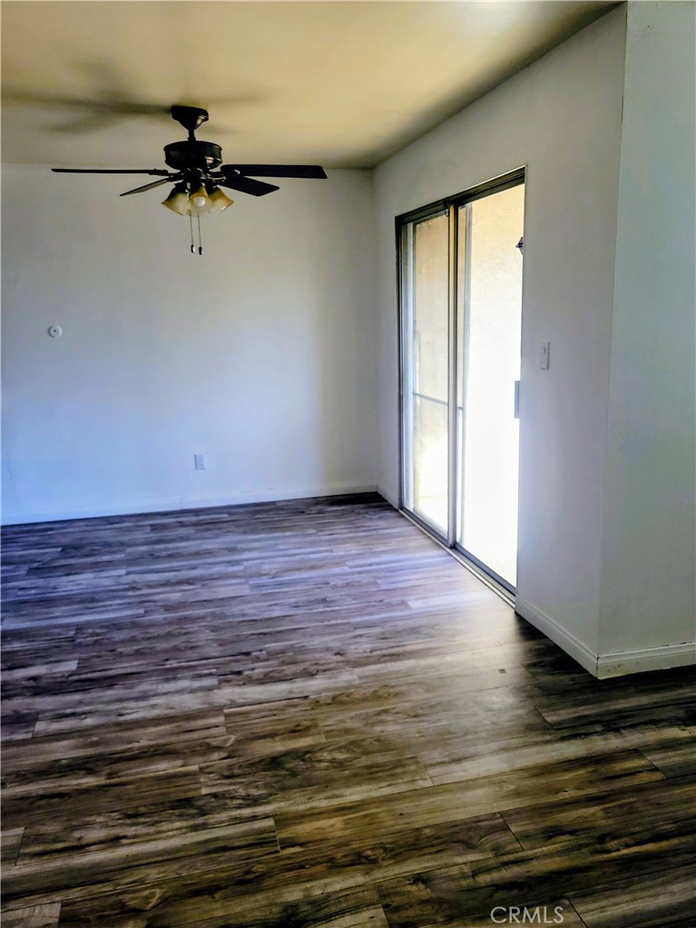 2255 Cahuilla Street, Unit 68 Colton, CA 92324 - Photo 12 of 30 a view of a room with wooden floor and a window