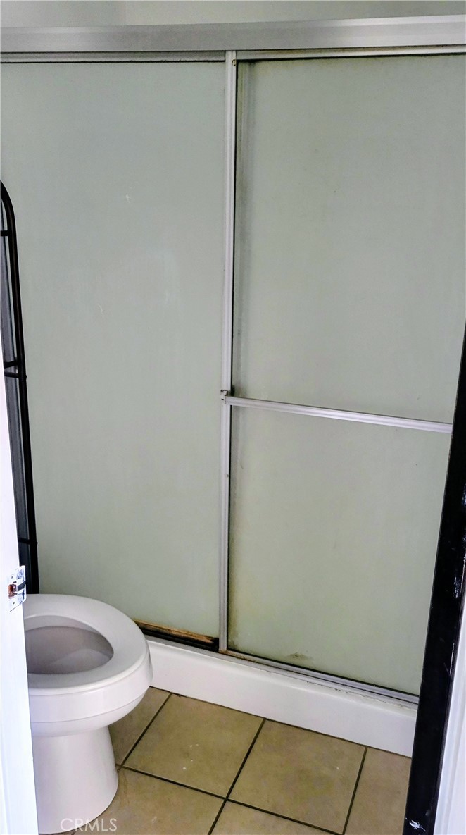 2255 Cahuilla Street, Unit 68 Colton, CA 92324 - Photo 16 of 30 a bathroom with a shower and a toilet