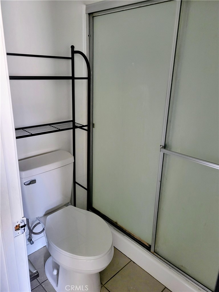 2255 Cahuilla Street, Unit 68 Colton, CA 92324 - Photo 17 of 30 a bathroom with a granite countertop toilet and a sink