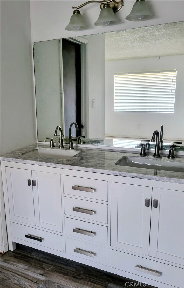 2255 Cahuilla Street, Unit 68 Colton, CA 92324 - Photo 18 of 30 a bathroom with a sink and a mirror