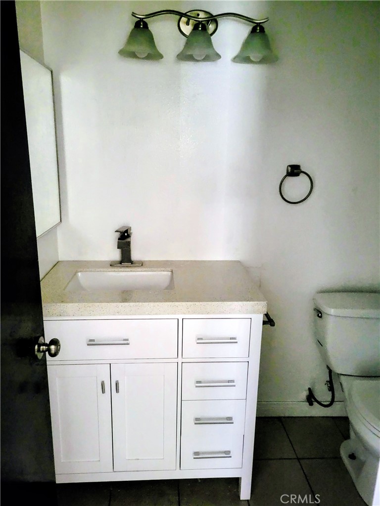 2255 Cahuilla Street, Unit 68 Colton, CA 92324 - Photo 19 of 30 a bathroom with a sink and a toilet