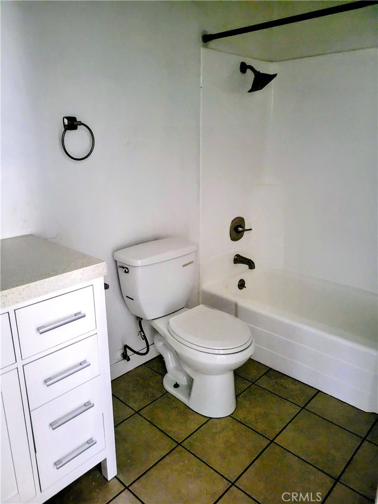 2255 Cahuilla Street, Unit 68 Colton, CA 92324 - Photo 20 of 30 a bathroom with a toilet a sink and a shower