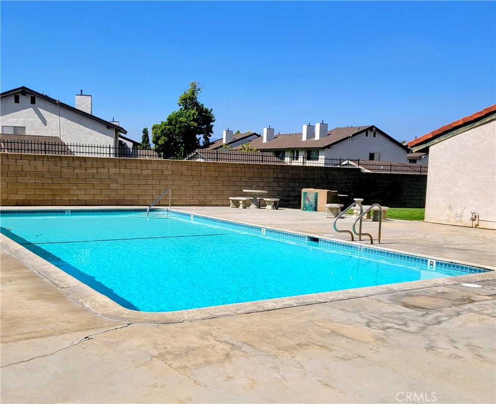 2255 Cahuilla Street, Unit 68 Colton, CA 92324 - Photo 3 of 30 a view of a house with a swimming pool