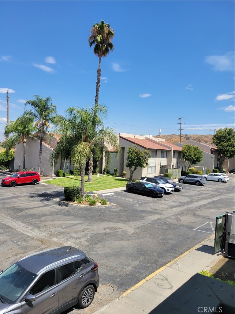 2255 Cahuilla Street, Unit 68 Colton, CA 92324 - Photo 8 of 30 a view of a street with cars parked on the road
