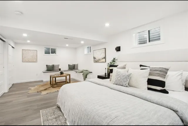 a bedroom with bed and a night stand