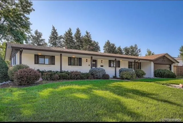 a view of a house that has a garden
