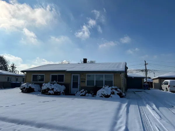 a view of a car parked in front of house