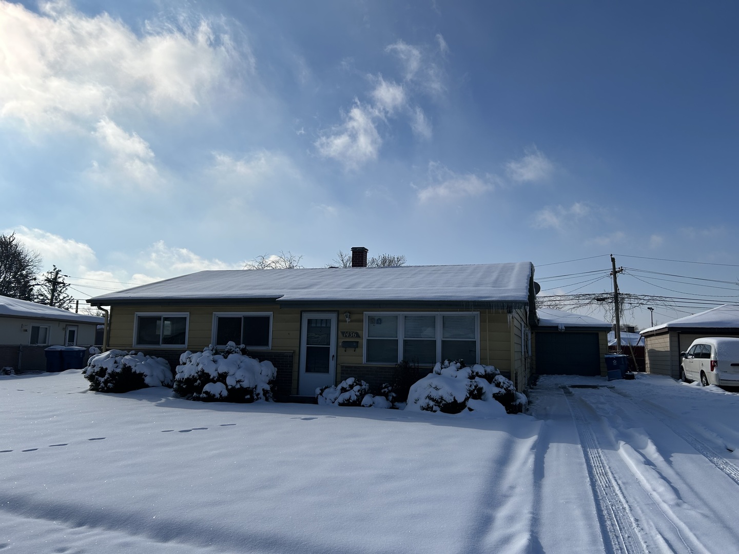 a view of a car parked in front of house