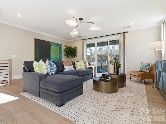 a dining room with a table chairs and kitchen view