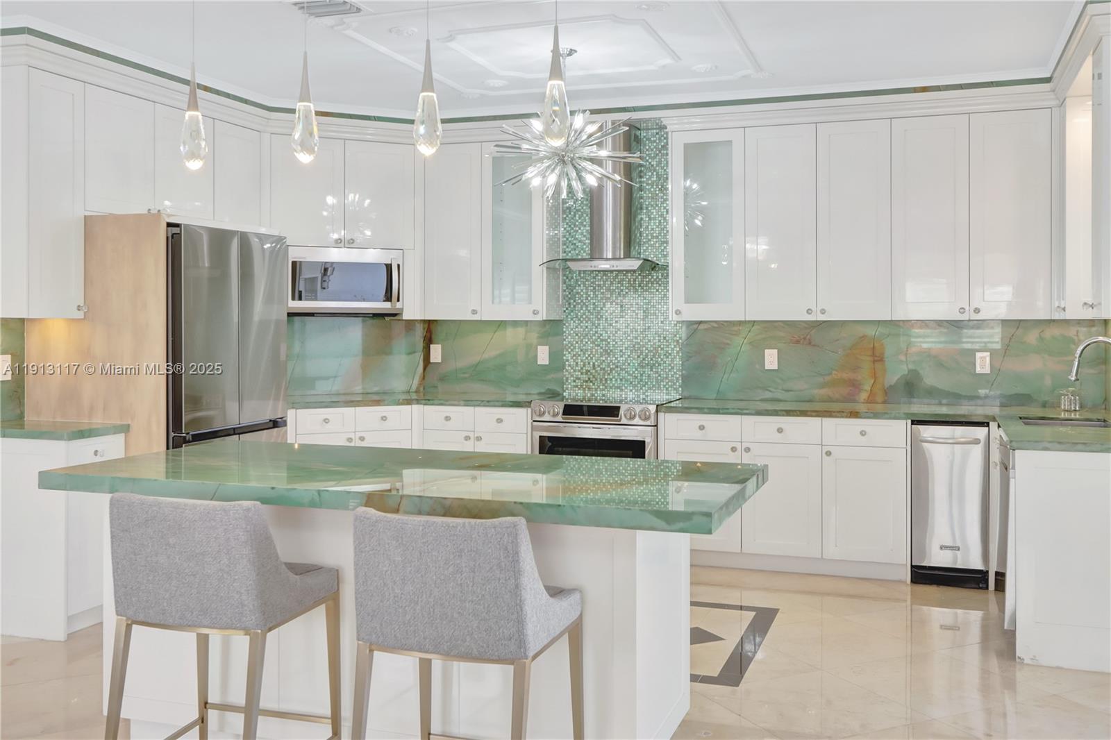 3191 Southwest 133rd Court Miami, FL 33175 - Photo 11 of 33 a kitchen with kitchen island a sink stove and refrigerator