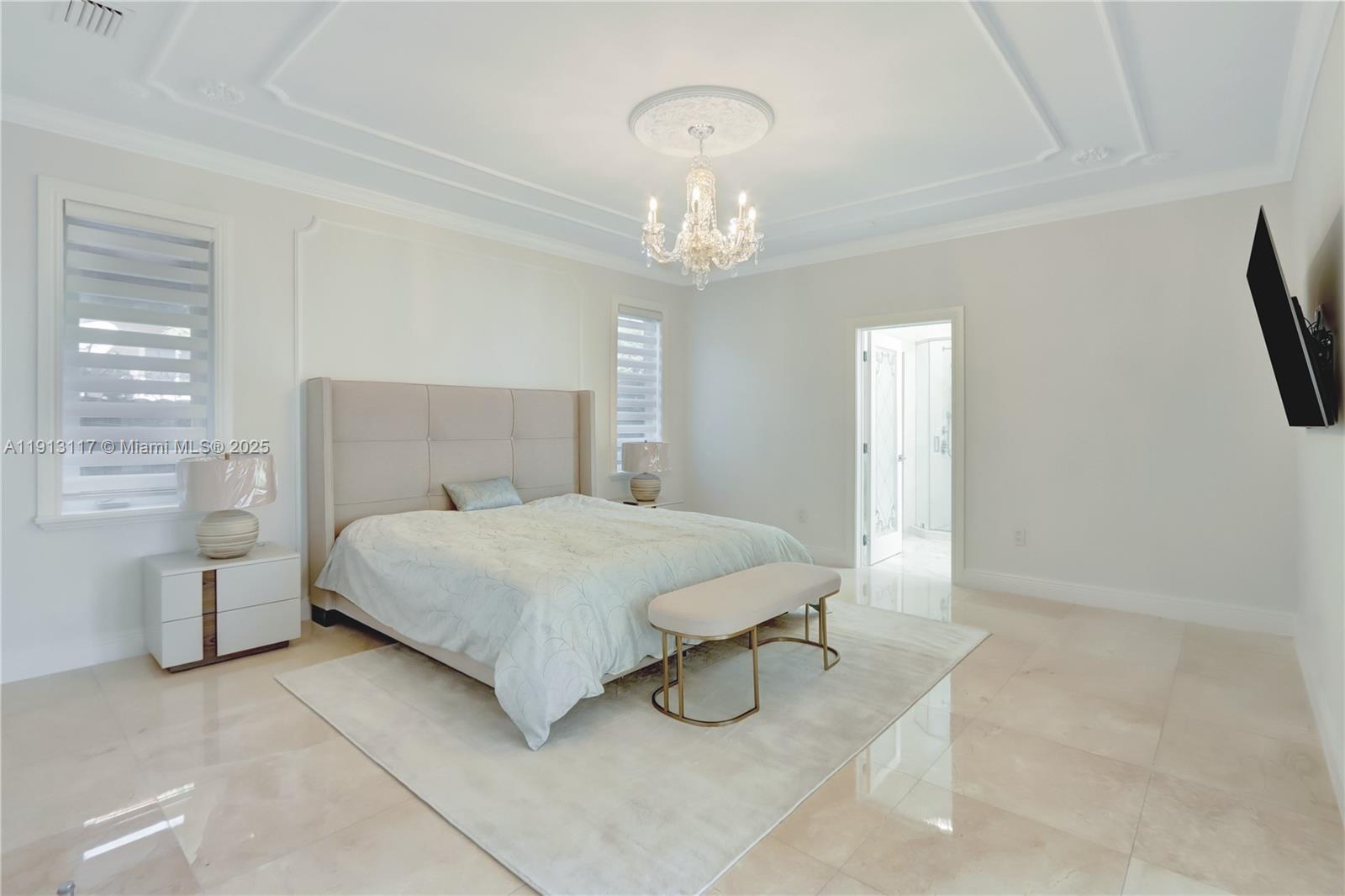 3191 Southwest 133rd Court Miami, FL 33175 - Photo 14 of 33 a bedroom with a bed and a chandelier