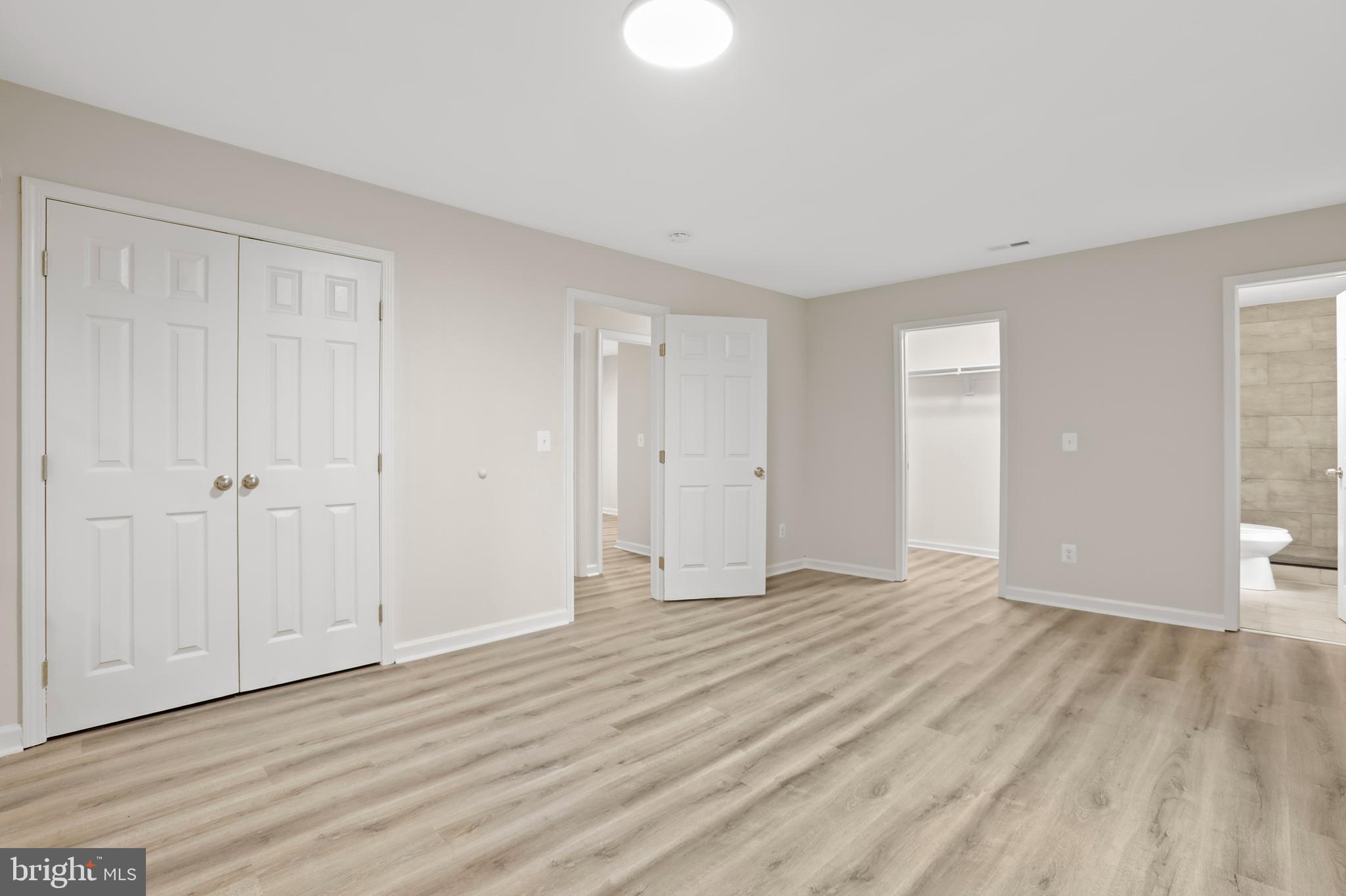 1003 Cedar Hill Road Colonial Beach, VA 22443 - Photo 14 of 25 a view of an empty room with wooden floor