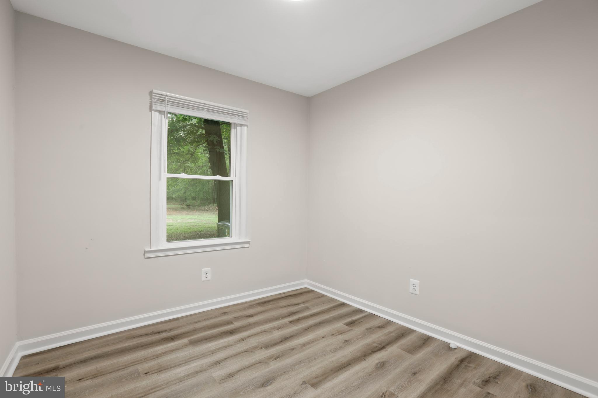 1003 Cedar Hill Road Colonial Beach, VA 22443 - Photo 22 of 25 an empty room with a window
