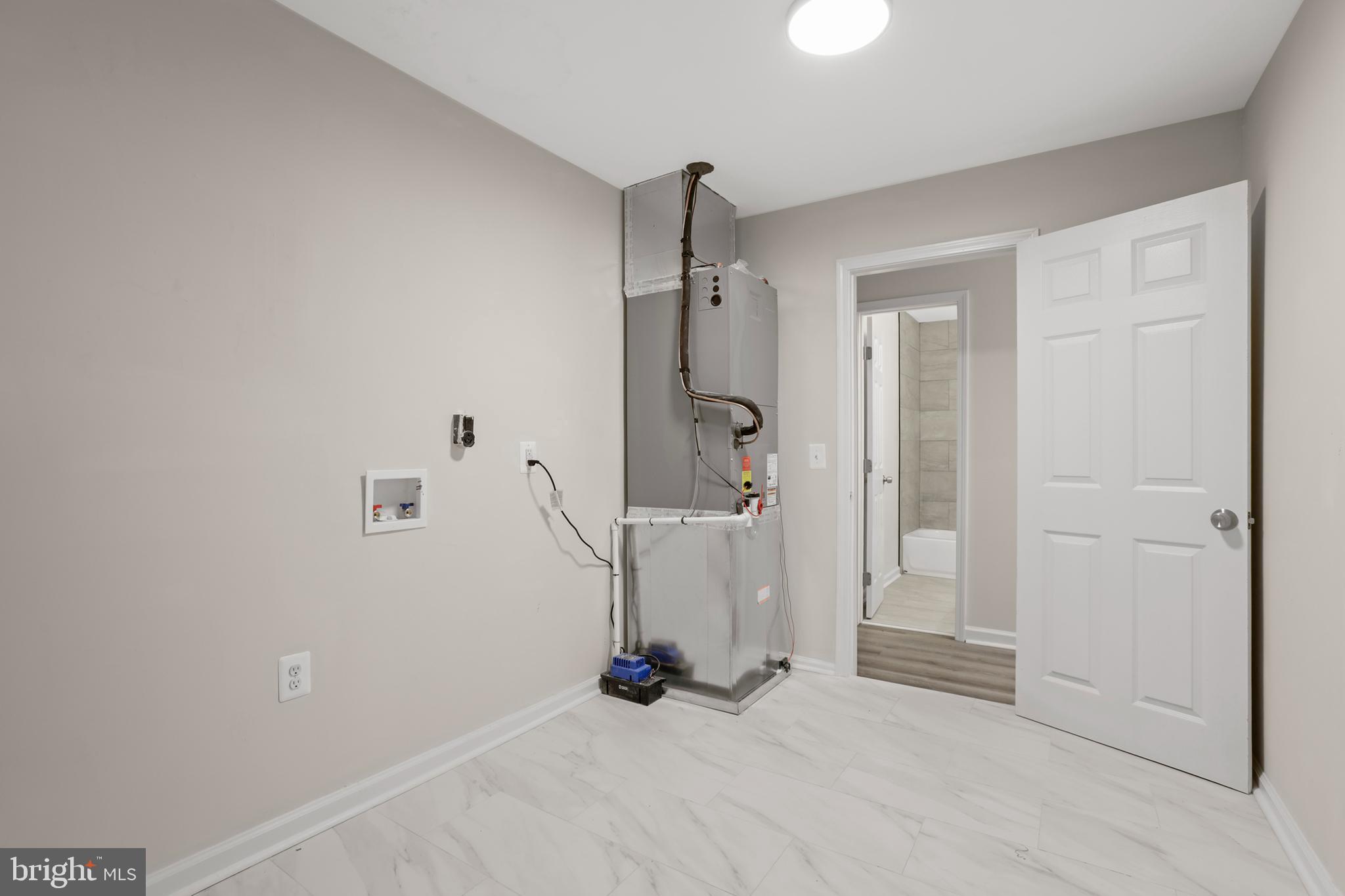 1003 Cedar Hill Road Colonial Beach, VA 22443 - Photo 24 of 25 an empty room with a door