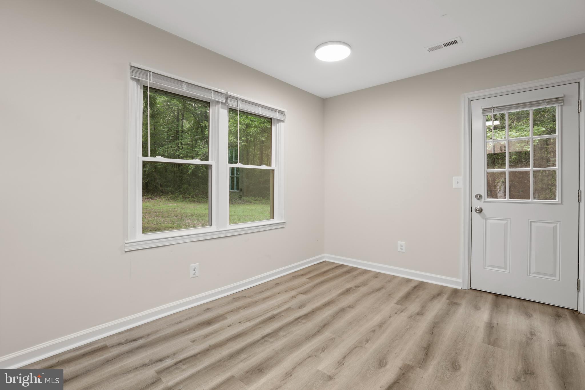 1003 Cedar Hill Road Colonial Beach, VA 22443 - Photo 10 of 25 an empty room with a window