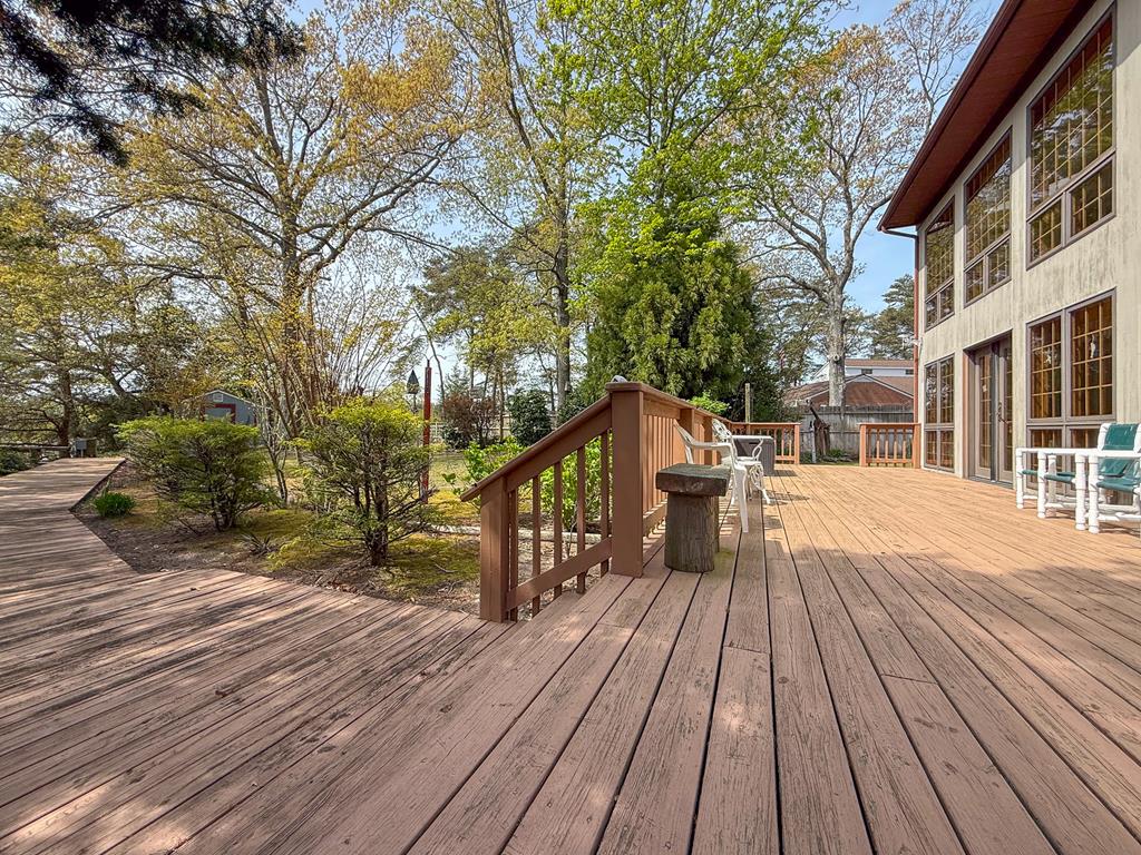 13581 Solitude Trail Machipongo, VA 23405 - Photo 26 of 51 a view of outdoor space with deck and large trees