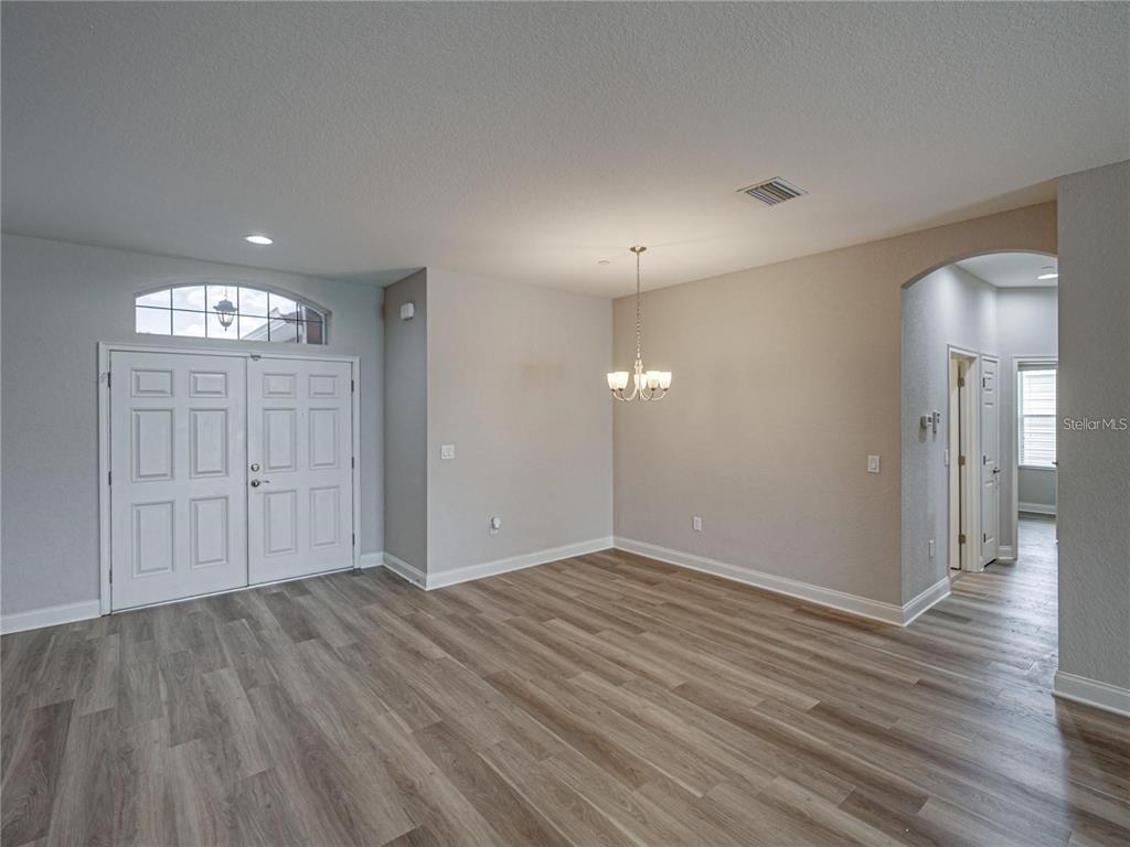 1918 Berry Road Plant City, FL 33567 - Photo 14 of 53 wooden floor in an empty room with a window