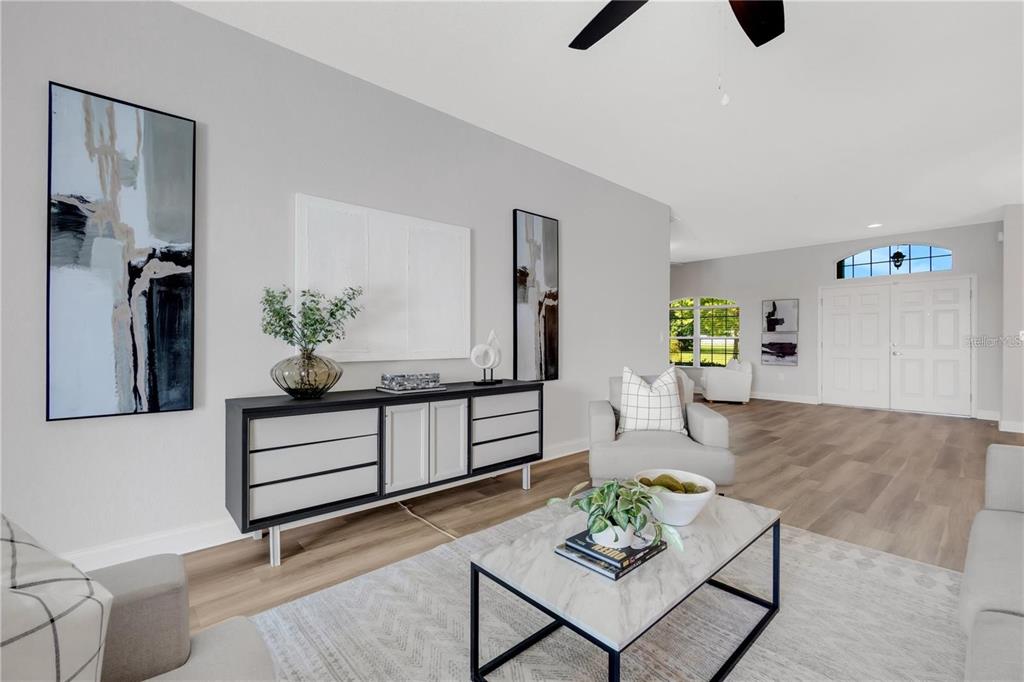 1918 Berry Road Plant City, FL 33567 - Photo 15 of 53 a living room with furniture and a potted plant