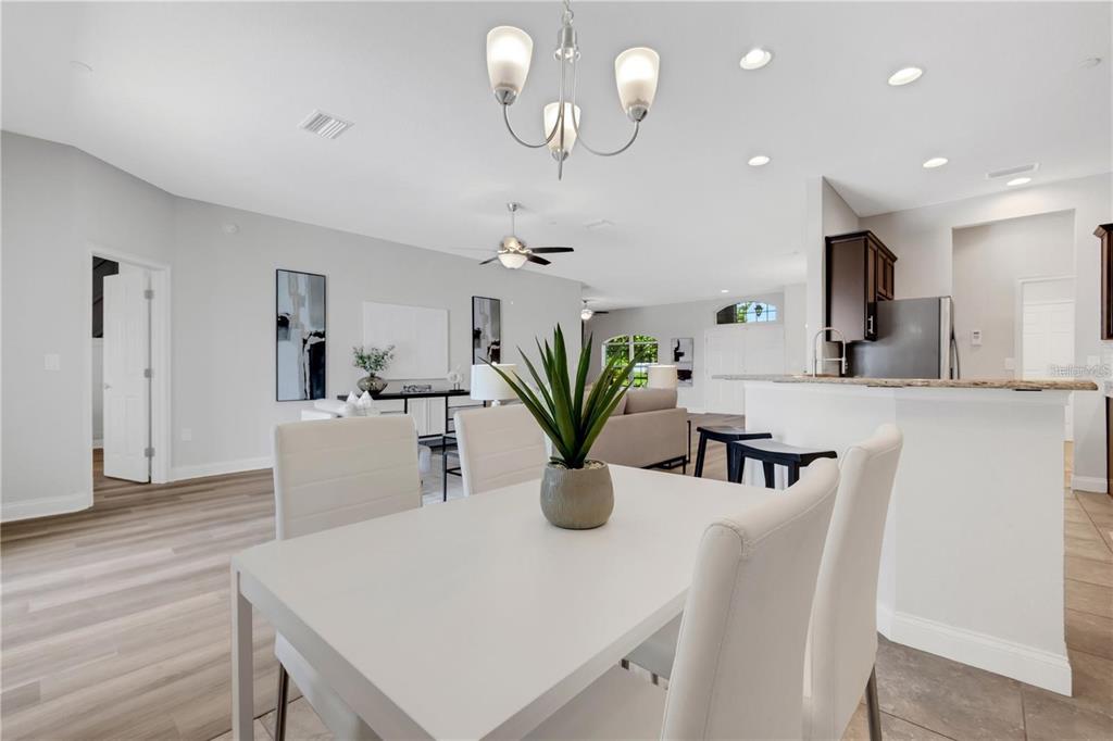 1918 Berry Road Plant City, FL 33567 - Photo 21 of 53 a kitchen with kitchen island a white stove top oven and a potted plant