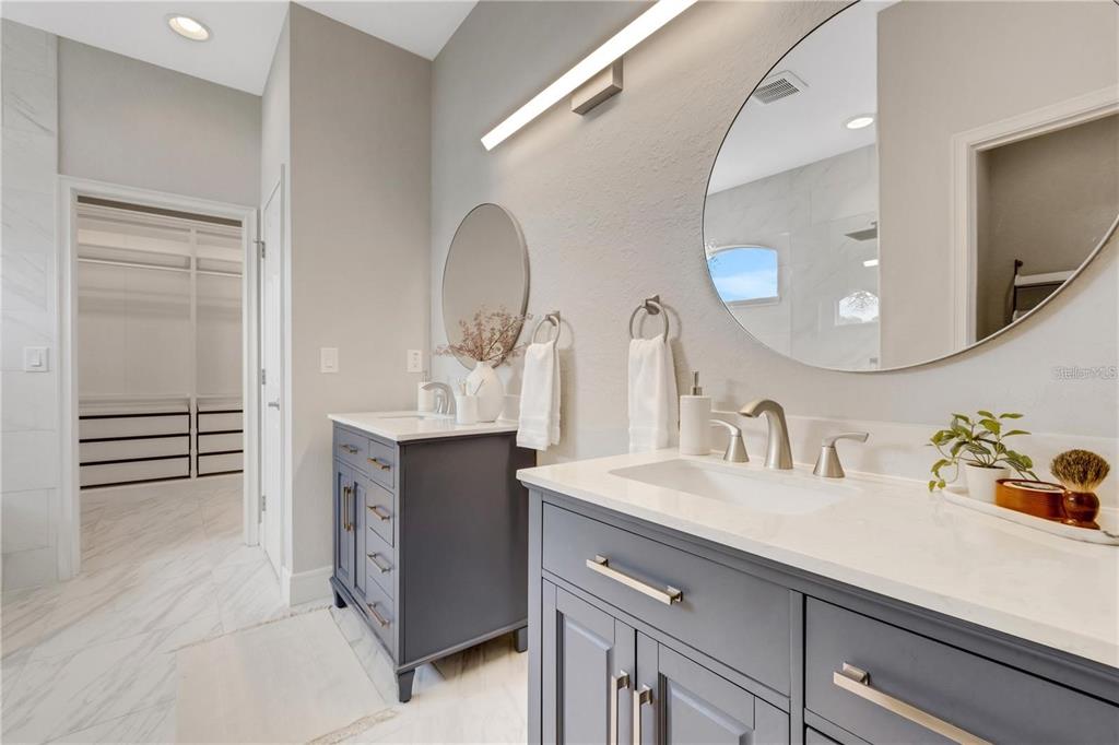 1918 Berry Road Plant City, FL 33567 - Photo 25 of 53 a bathroom with a double vanity sink and a mirror