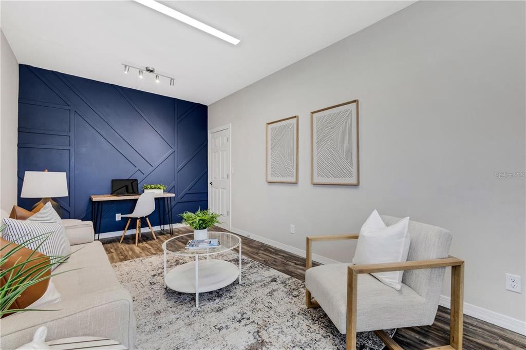 1918 Berry Road Plant City, FL 33567 - Photo 27 of 53 a living room with furniture and a mirror