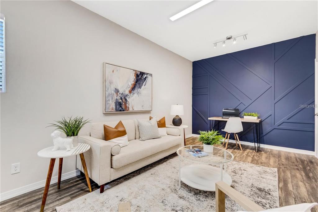 1918 Berry Road Plant City, FL 33567 - Photo 28 of 53 a living room with furniture and wooden floor