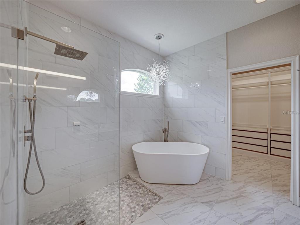 1918 Berry Road Plant City, FL 33567 - Photo 34 of 53 a bathroom with a bathtub and shower