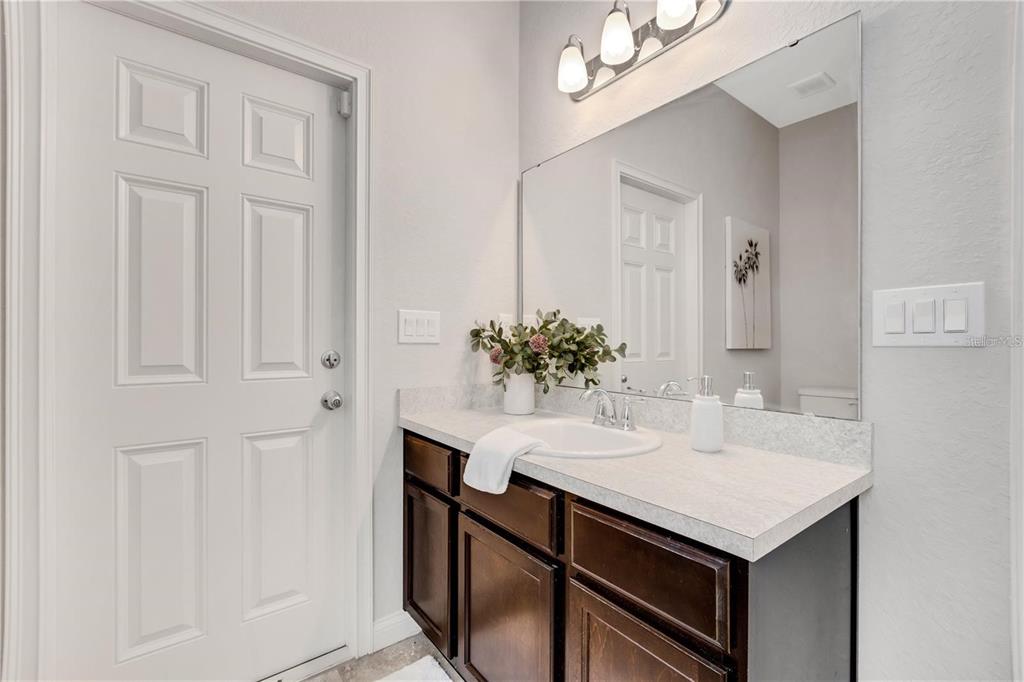 1918 Berry Road Plant City, FL 33567 - Photo 38 of 53 a bathroom with a sink and a mirror